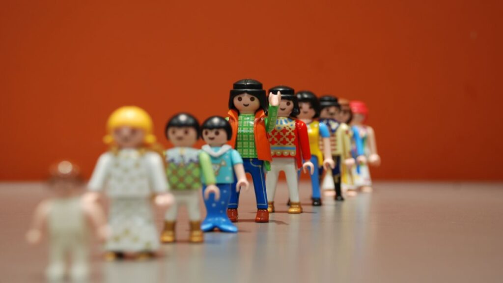 Playmobil figure front view with several characters